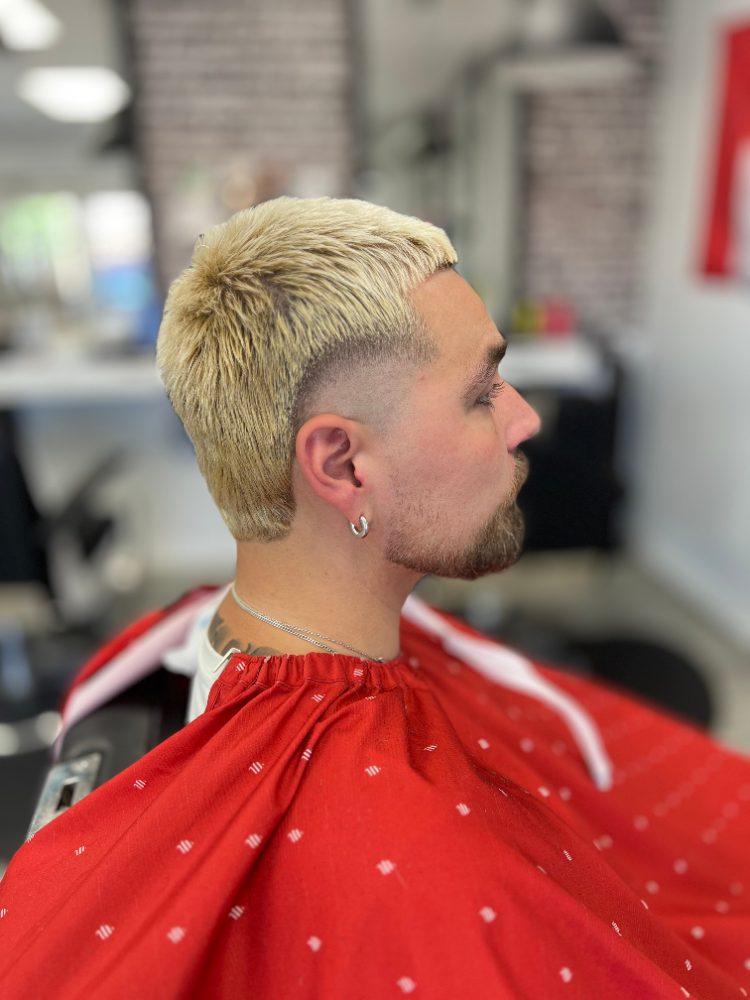 Blond crop with a clean skin fade and beard shape-up